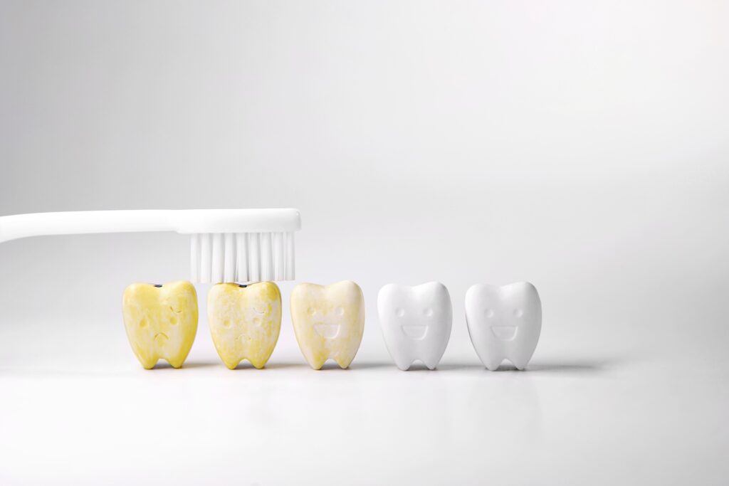 why do teeth turn yellow despite regular brushing