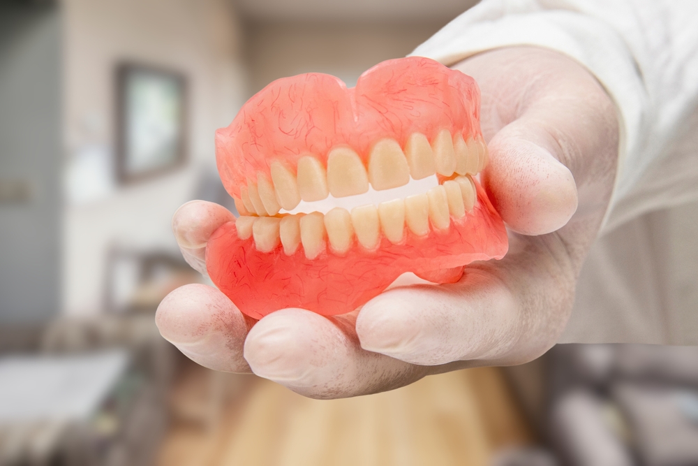how can partial dentures help you save money
