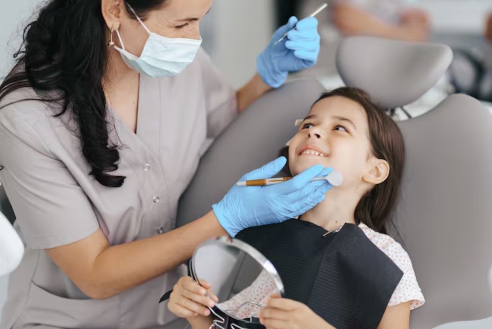child receiving a dental checkup to help prevent tooth decay and cavities